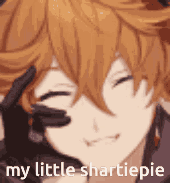 a close up of a person 's face with the words `` my little smartiepie '' written on it .
