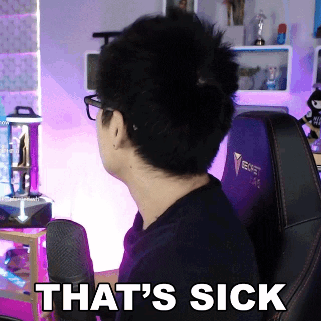 a man sitting in a chair with the words that 's sick written on the bottom