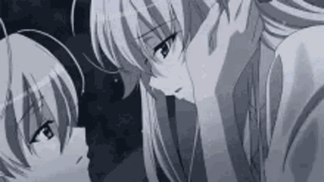 a couple of anime characters are looking at each other .