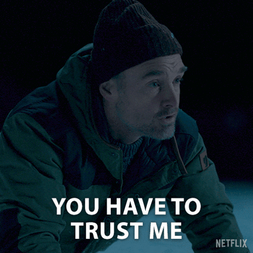 a man wearing a beanie and a jacket says you have to trust me