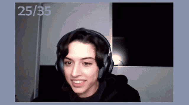 a woman wearing headphones with the number 25/35 on the bottom right