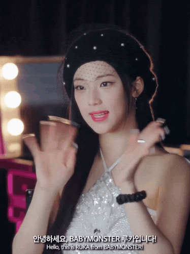 a woman wearing a black beret and a white top says hello this is ruka from babymonster