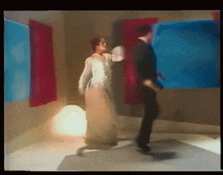 a blurry picture of a man and woman dancing