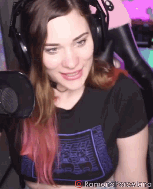 a woman wearing headphones and a ramona porcelana shirt