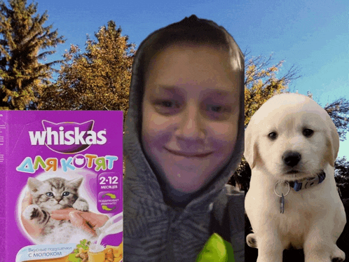 a box of whiskas puppy food next to a person