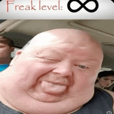 a bald man with a beard is sticking his tongue out in front of a sign that says freak level 8