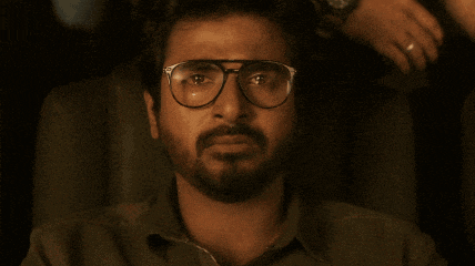 a man wearing glasses covering his mouth with his hand and the words mr romantic above him