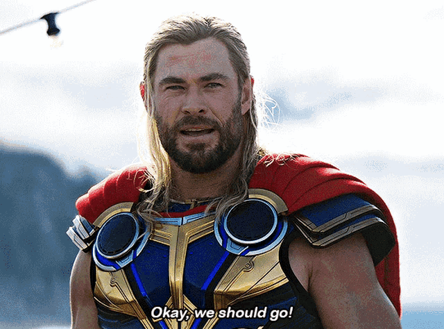 a man in a superhero costume is saying okay we should go