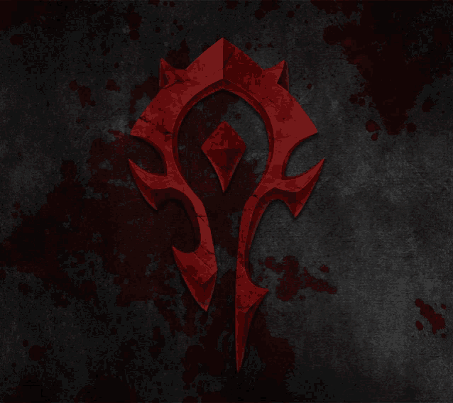 a red symbol with a diamond in the middle is on a dark background