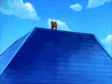 a cartoon character is standing on the roof of a building .