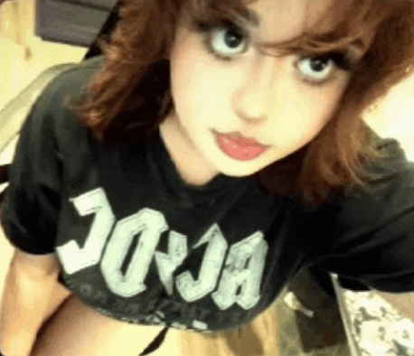 a girl is wearing a black joya shirt