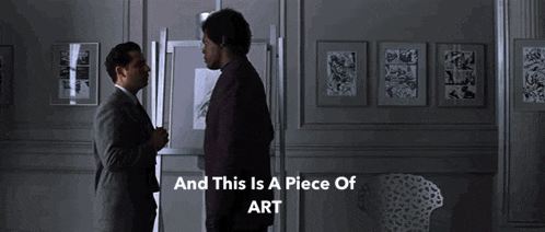 two men standing next to each other in a dark room with the words and this is a piece of art below them