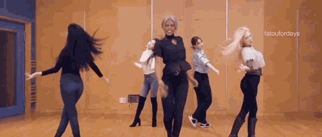 a group of women are dancing in a room with the caption " tatoufordays " on the bottom