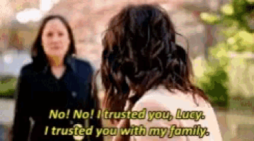 two women are standing next to each other and one of them is saying no no i trusted you lucy