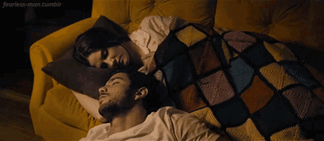 a man and a woman laying on a yellow couch with fearless-man.tumblr written on the bottom