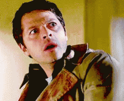 a man in a brown jacket is making a surprised face