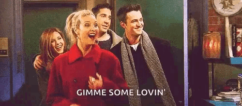 a group of people standing next to each other with the words `` gimme some lovin '' .
