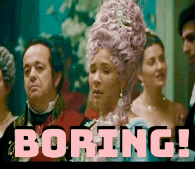 a woman in a pink wig stands in front of a group of people and the word boring is on the screen