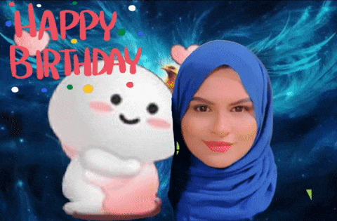 a woman in a blue hijab is standing next to a stuffed animal with the words happy birthday written on it