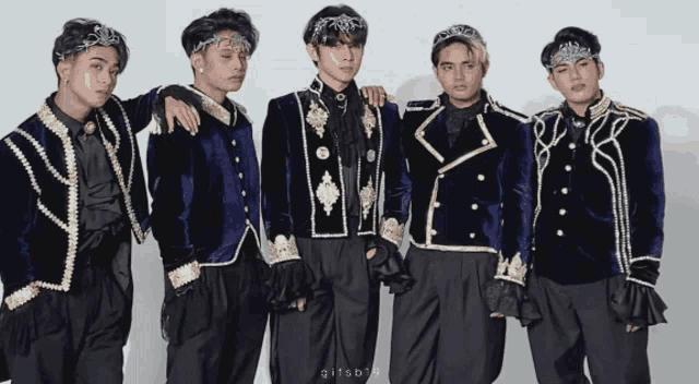 a group of men standing next to each other with the letters gifsb on the bottom right