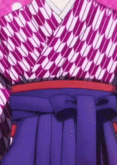 a close up of a person wearing a purple and pink kimono and a blue skirt .