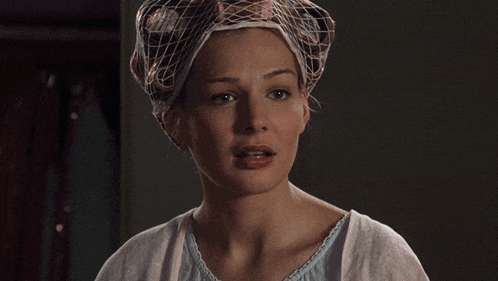 a woman wearing a white veil on her head