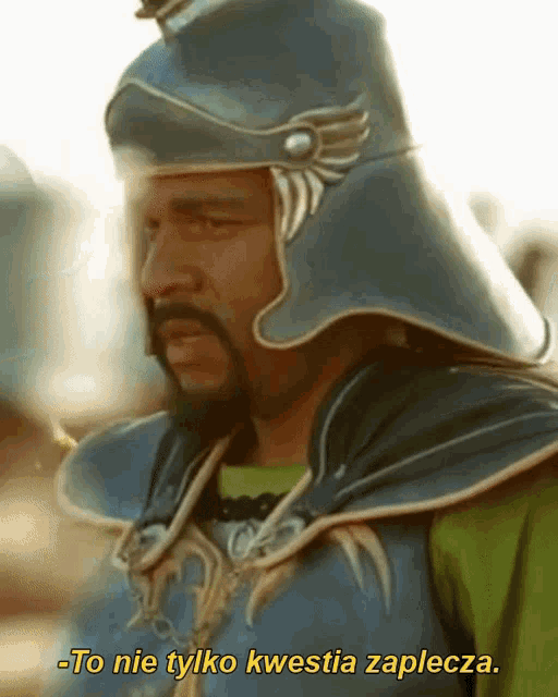 a man with a beard wearing a helmet says -to nie tylko kwastia zaplecza