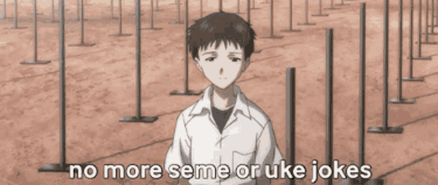 a man in a white shirt stands in front of a row of fence posts with the words " no more semen or uke jokes "