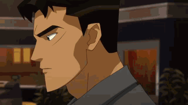 a close up of a cartoon man 's face with a serious look on his face