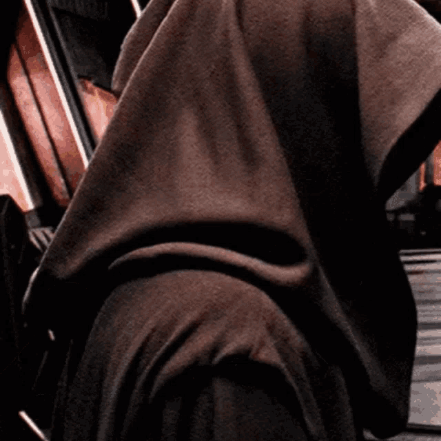 a close up of a person wearing a hood