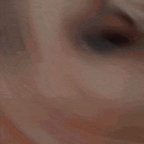 a close up of a woman 's face with a lightning bolt in the background