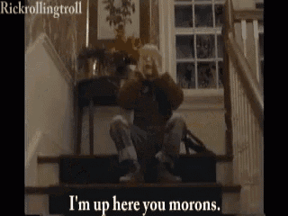 a man is sitting on the stairs with his hands on his face and says `` i 'm up here you morons ''