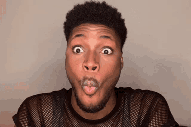 a man making a funny face with his mouth open