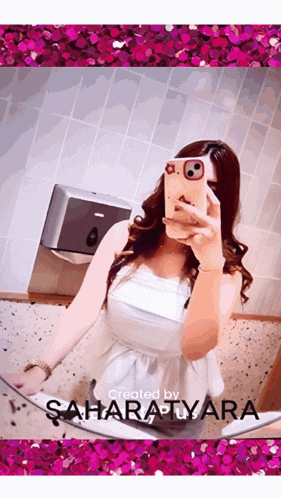 a woman taking a picture of herself in a mirror with the name saharatuvara written on the bottom