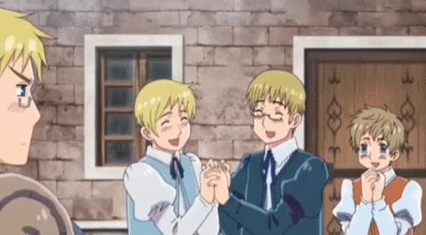 a group of anime boys are standing in front of a brick building .