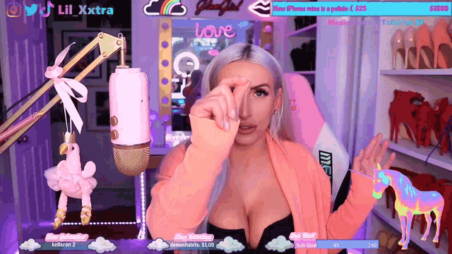 a woman is giving a speech in front of a microphone and a sign that says love on it