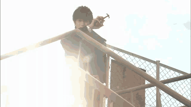 a man standing on a railing with the words " the chosen one " written below him