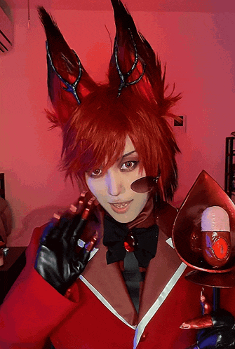 a woman in a red fox costume holds a spoon