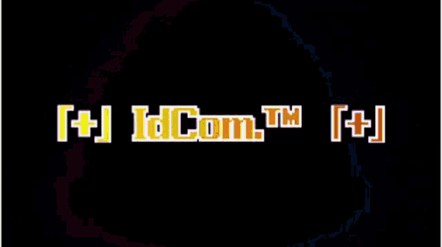 a blue and red triangle with the words idcom tm written on it