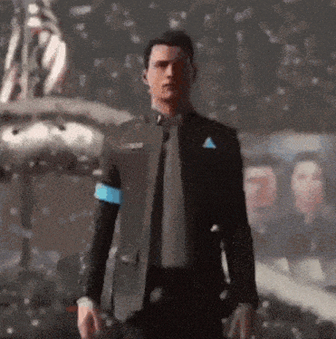 a man in a suit and tie is standing on a stage in front of a crowd .