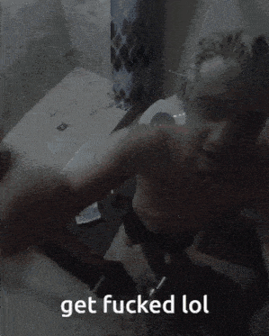 a blurry picture of a man with the words get fucked lol written below him