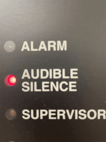 a button that says alarm audible silence and supervisor on it