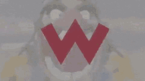 a cartoon character with a large red w in his mouth