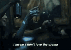 a woman holding a glass of wine says i swear i don 't love the drama