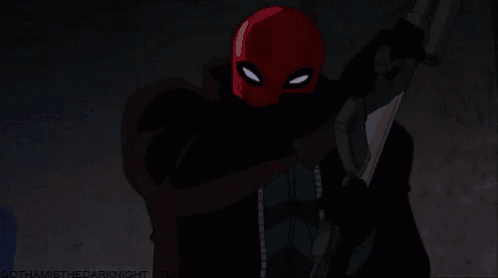 a cartoon character with a red mask is holding a gun and pointing it