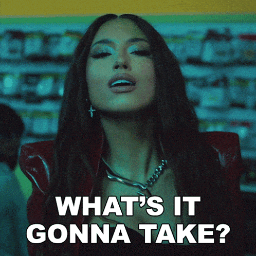 a woman says " what 's it gonna take " in front of her