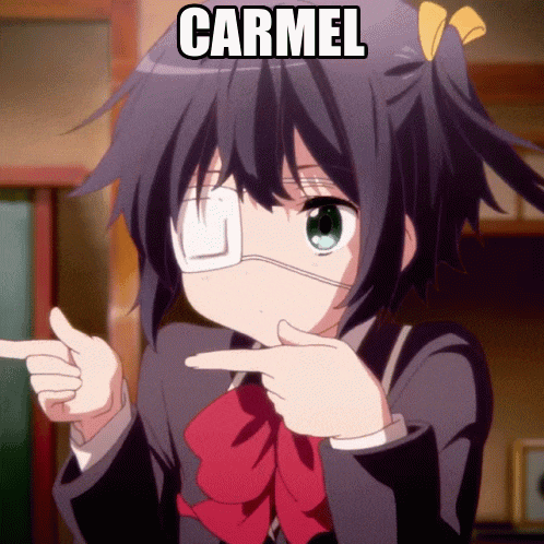 a girl with a bandage on her eye is pointing at the word carmel