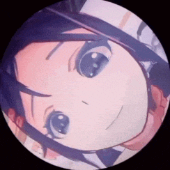 a close up of a person 's face in a circle with a black background .