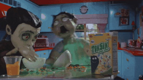 a box of toxstik cereal with a monster eating it