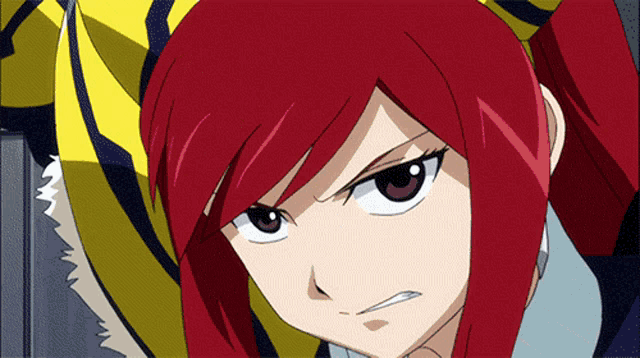 a close up of a red haired anime character with a yellow and black striped shirt